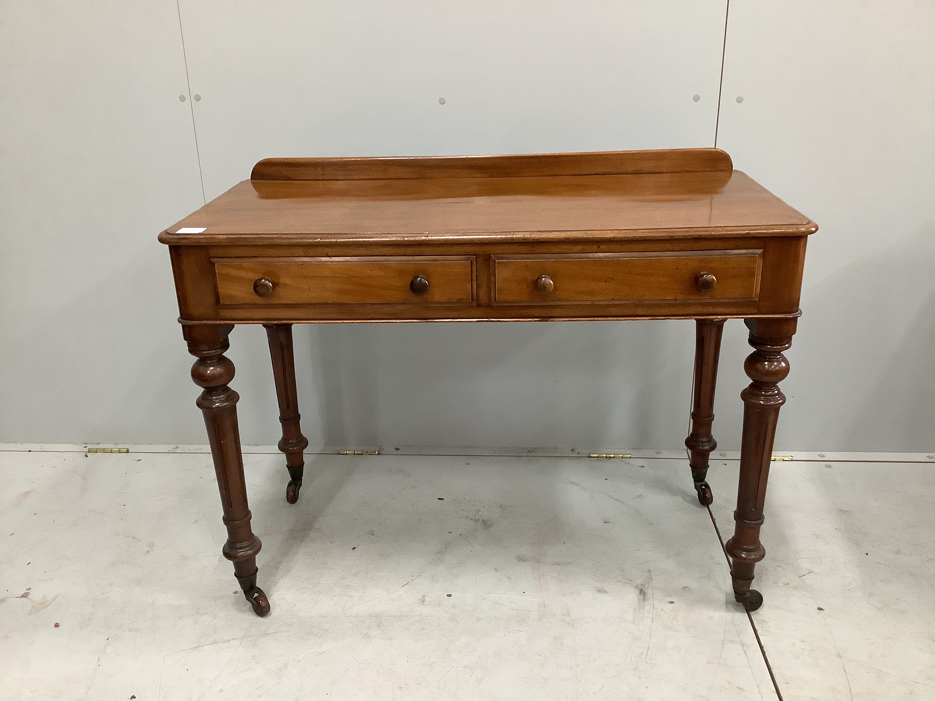 A Victorian mahogany two drawer side table, width 106cm, depth 49cm, height 80cm